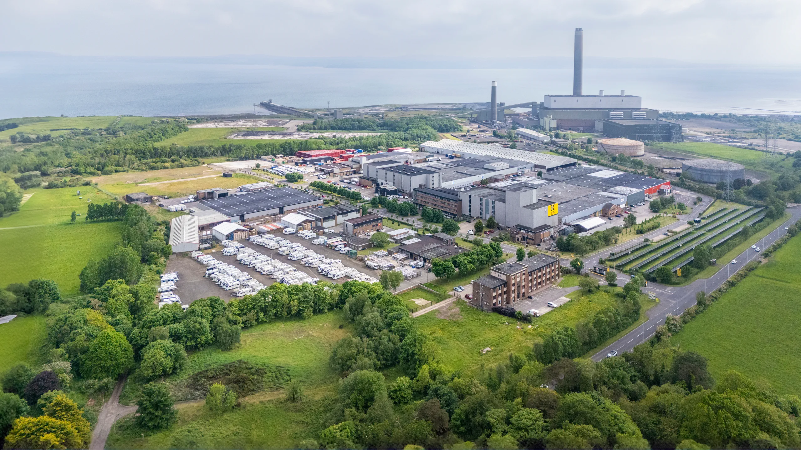 Aerial view of Kilroot Business Park with Kilroot Power Station and Belfast Lough